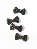 BALOVESYOU Crayon Confetti pet hair clips with colorful abstract details on black bow fabric.