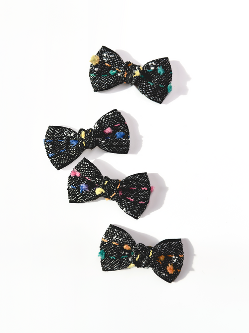 BALOVESYOU Crayon Confetti pet hair clips with colorful abstract details on black bow fabric.
