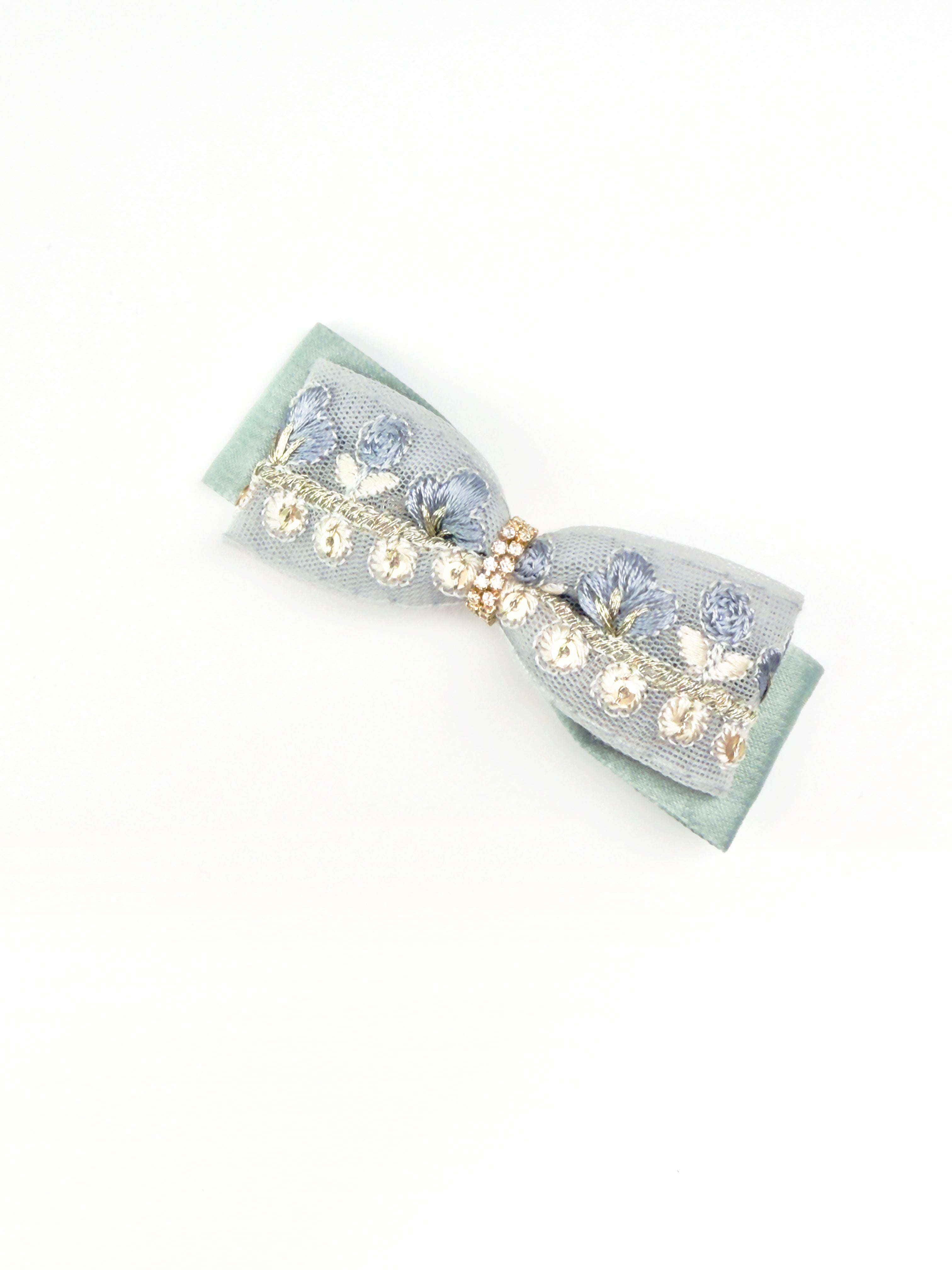 Angled view of the BALOVESYOU Dawn Shimmer pet hair clip with delicate pearl and floral details.