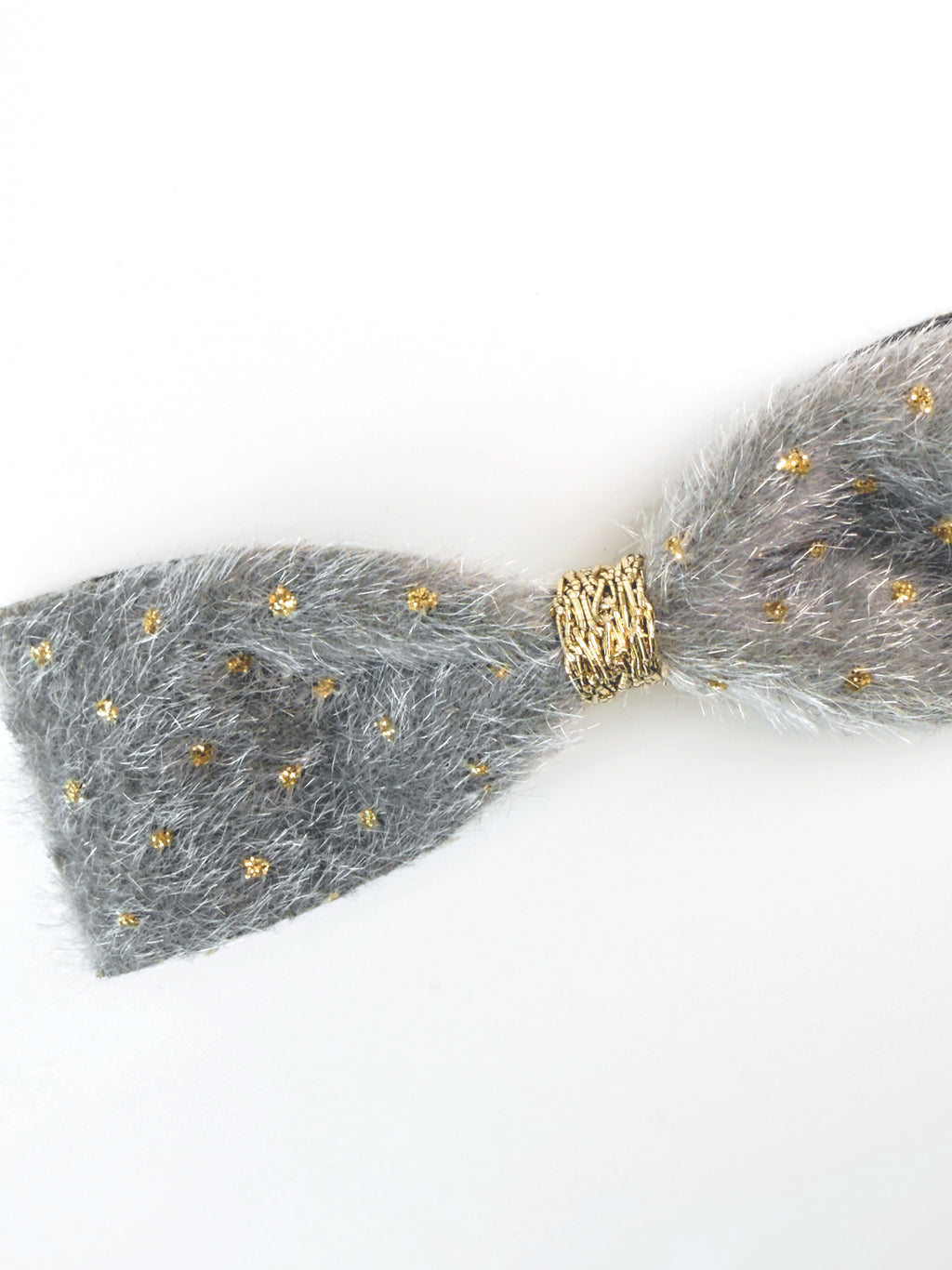 Close-up of the Silver fabric and delicate gold embellishments on the BALOVESYOU Stardust pet hair clip.
