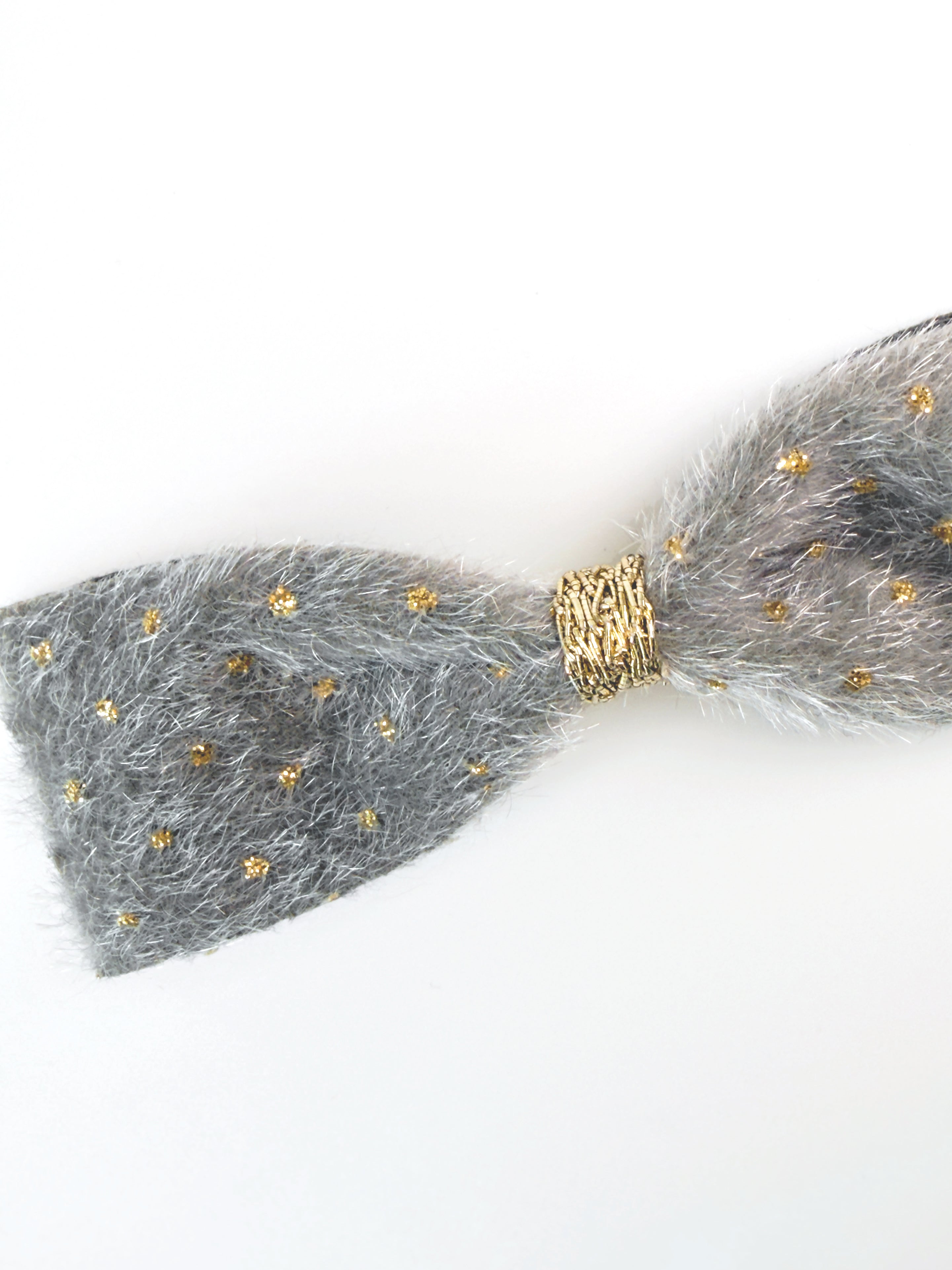 Close-up of the Silver fabric and delicate gold embellishments on the BALOVESYOU Stardust pet hair clip.