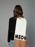 Back view of a woman modeling the CAT-Sophy "MEOW" theme oversized scarf in grey, brown, and blue-striped colorblock.