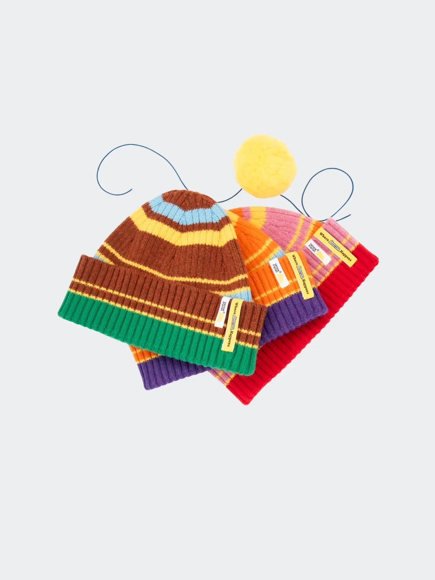 A collection flat-lay showcasing the Striped Wool Beanies in Vibrant Orange, Pink, and Chestnut Brown colorways.