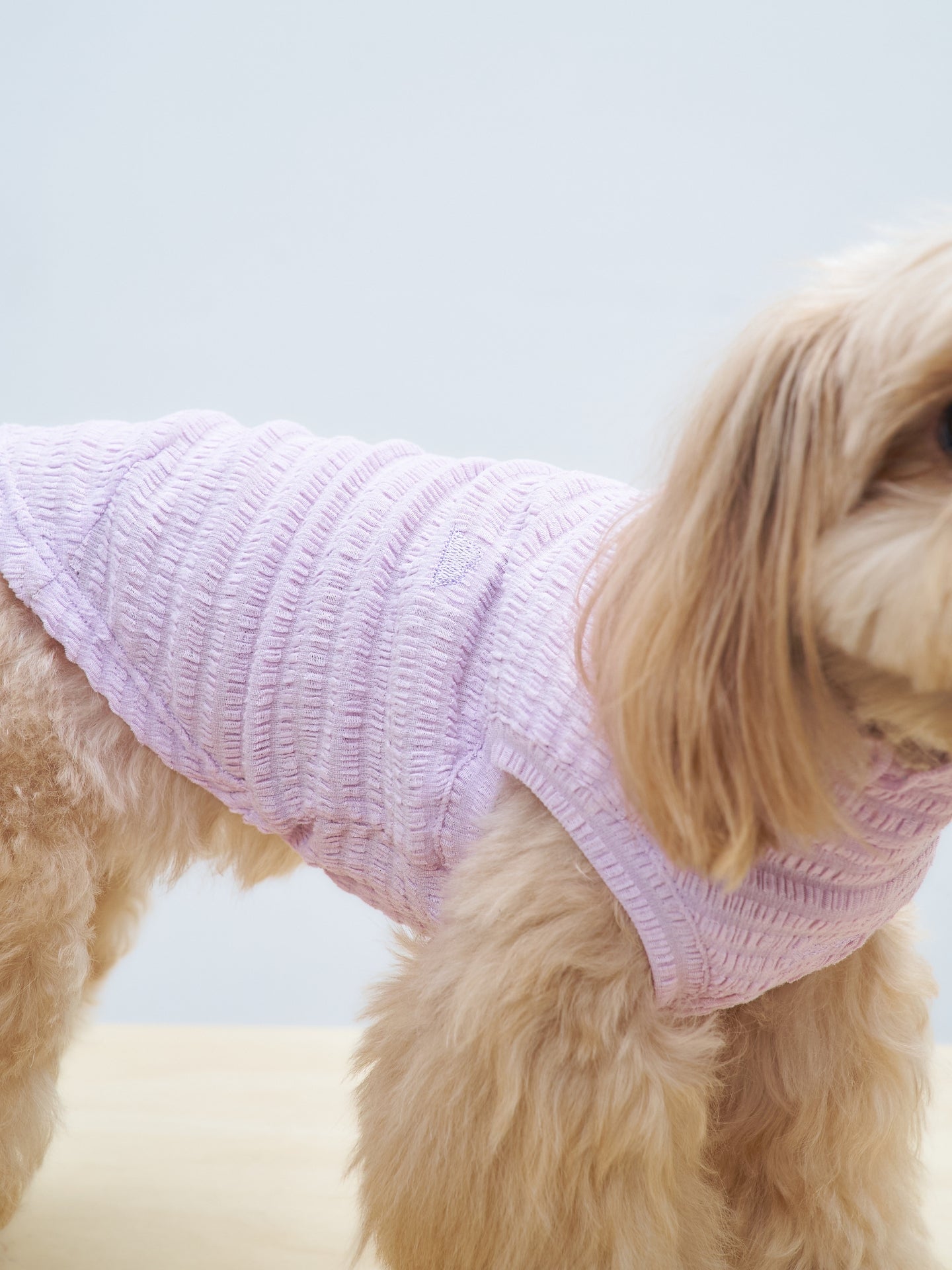 Close-up of the fit and wavy textured fabric of the Colorful Daily AIRWave Tank in Purple.