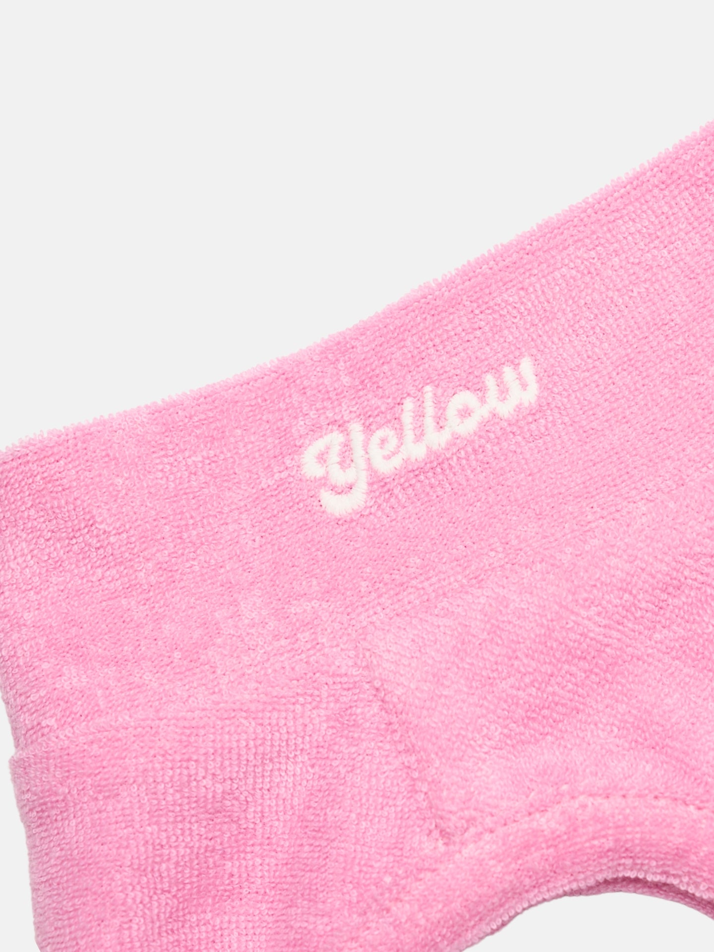 Close-up of the Pink soft terry fabric and Yellow logo detail on the Colorful Daily Soft Terry Tank.