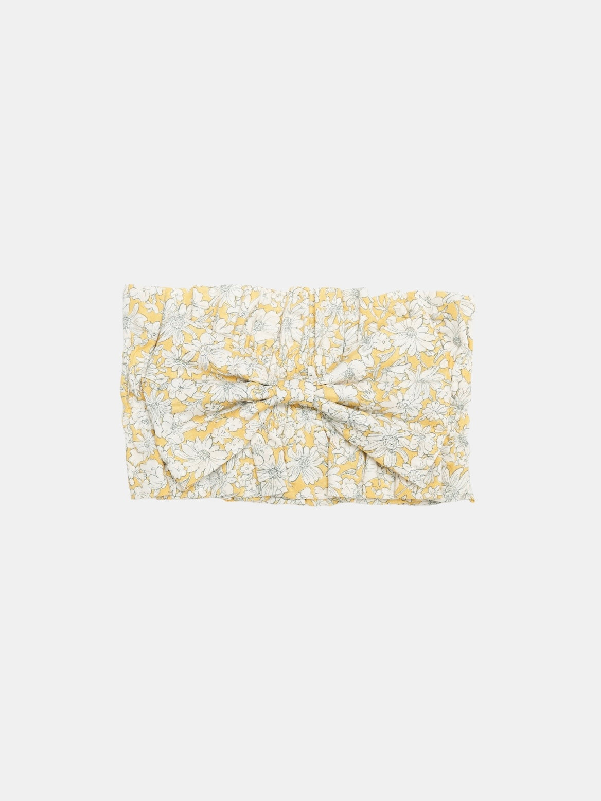 Close-up of the Colorful Daily Nature's Verse Bow Neckpiece in Daisy showing the floral printed fabric, gathered texture, and Yellow Planet label.