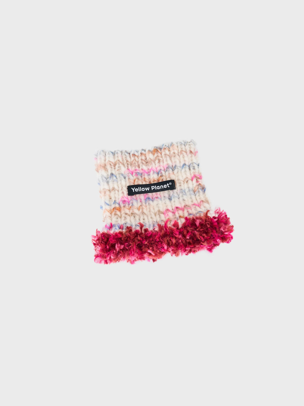 Main studio shot of the limited edition "Blossom-2" hand-knitted luxe pet snood in cream speckled wool with wine red fringe tassels.