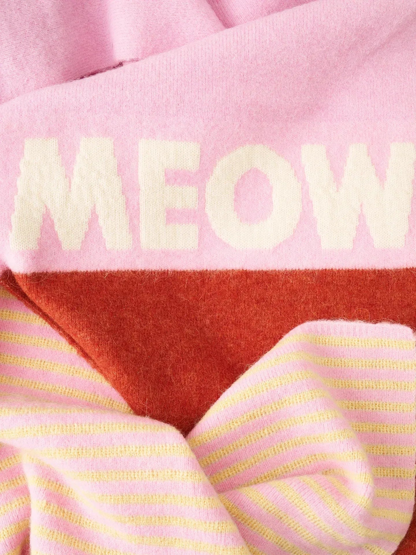 Close-up of the yellow and pink striped section of the luxury alpaca-mohair scarf, showcasing the fuzzy, high-quality knit texture.