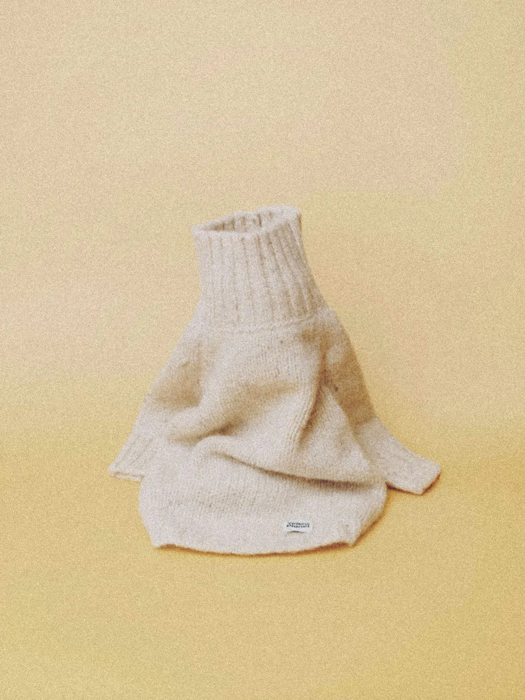 Main product view of the Milk Tweed alpaca-wool dog sweater in a soft off-white color with a high ribbed neck.