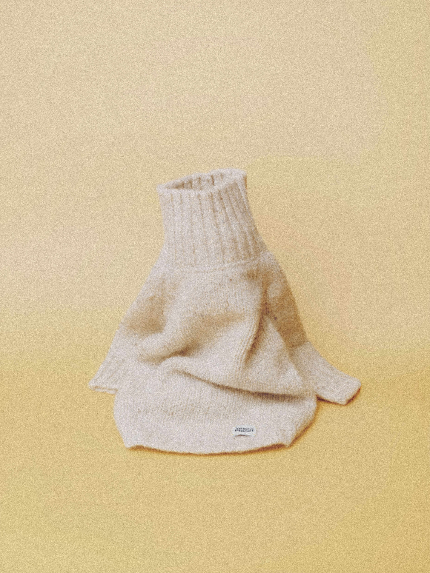 Main product view of the Milk Tweed alpaca-wool dog sweater in a soft off-white color with a high ribbed neck.