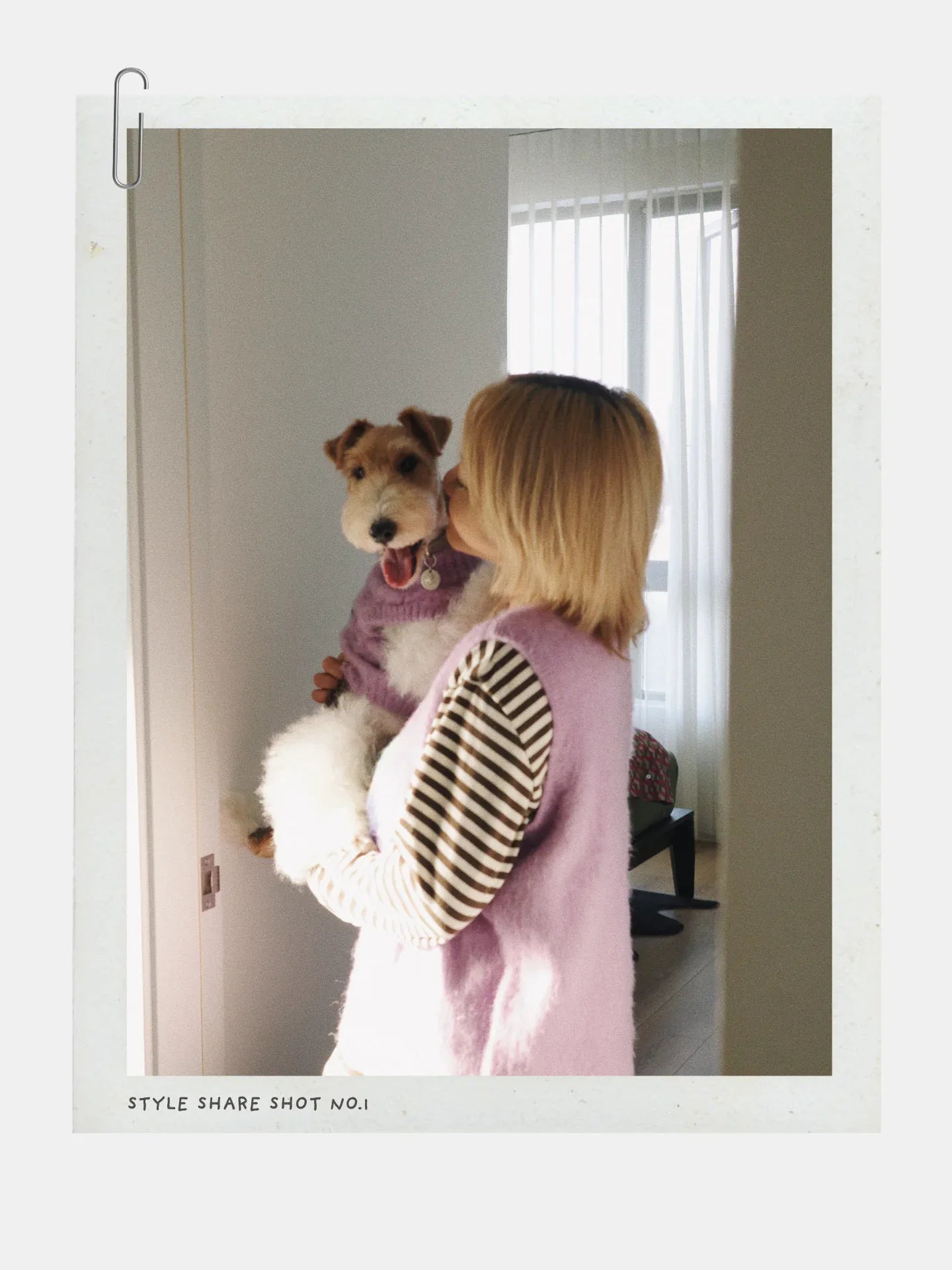 Lifestyle photo of a person wearing the Night Grape vest while holding a dog, showcasing the Human Edition fit.