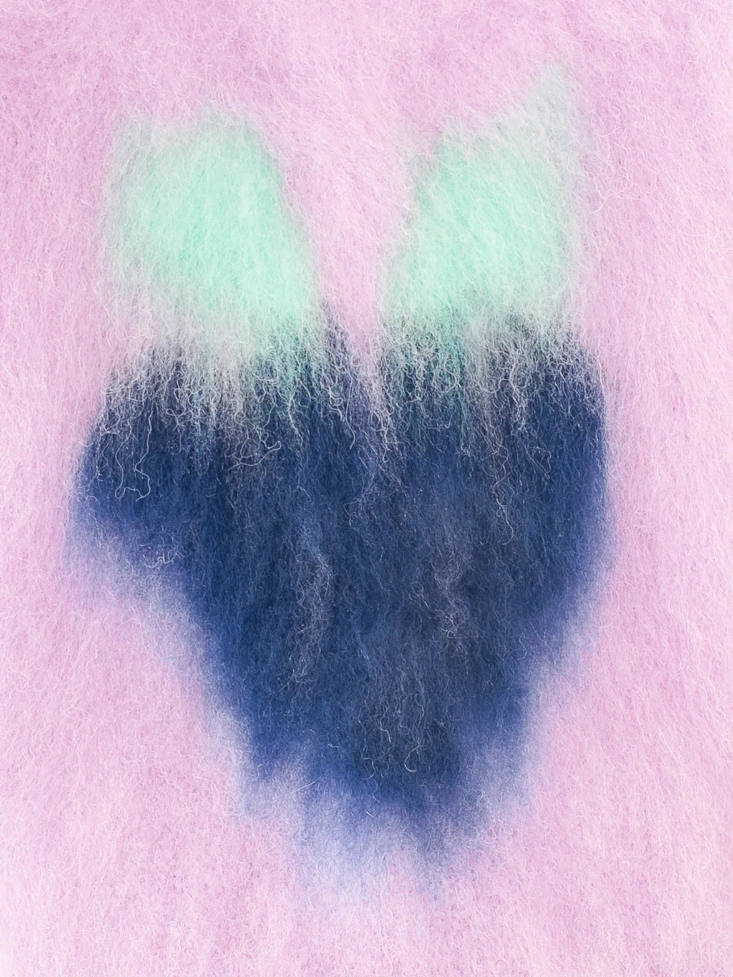 Close-up detail of the soft brushed knit fabric texture of the Night Grape fruit vest from the artist collaboration series.