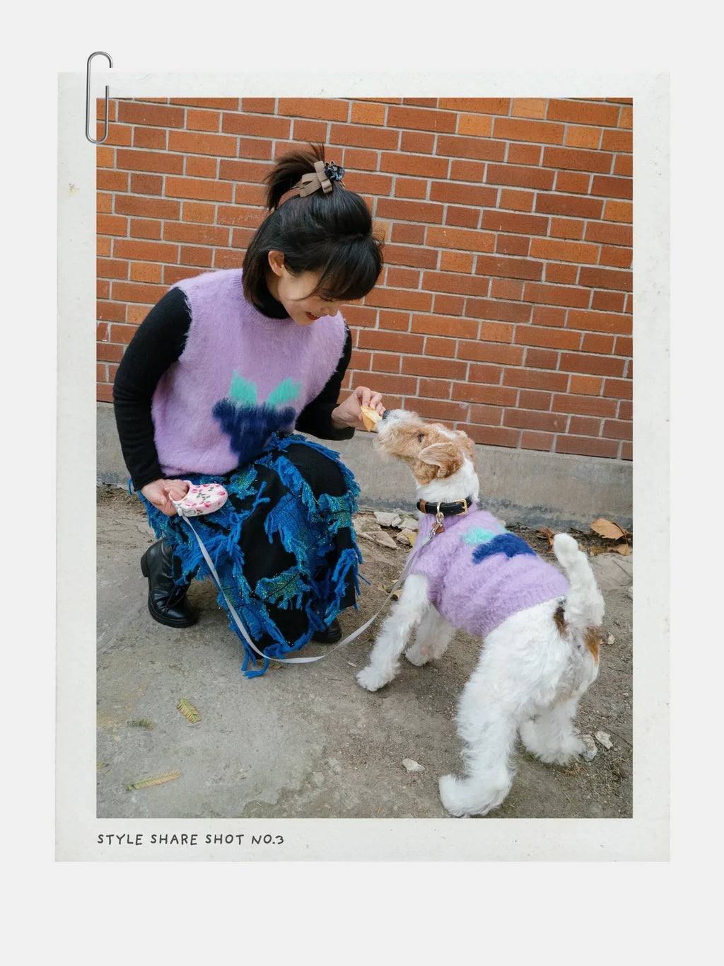 A person in the Night Grape vest interacting with a dog, highlighting the playful nature of the artist collaboration.