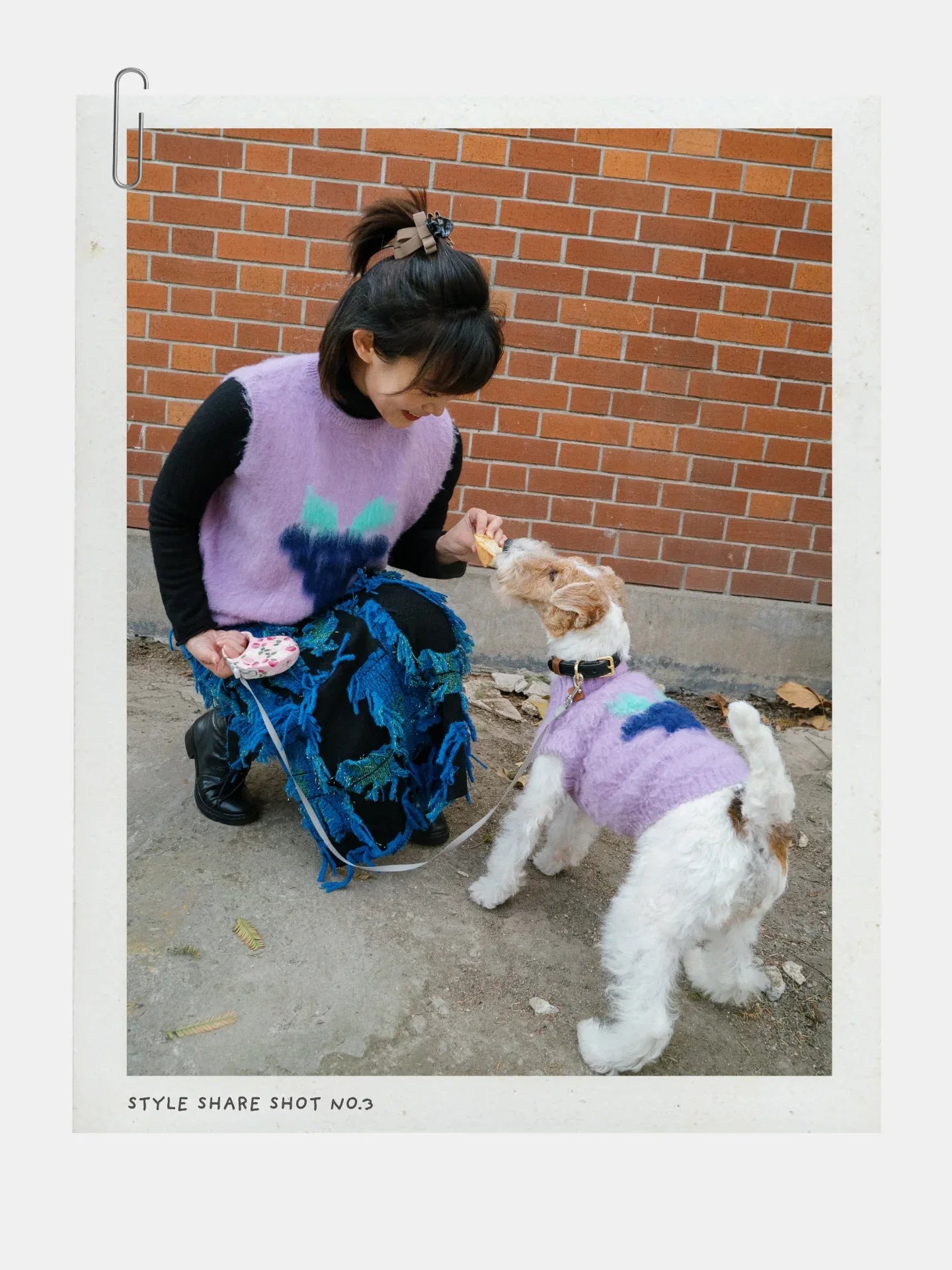 A person in the Night Grape vest interacting with a dog, highlighting the playful nature of the artist collaboration.