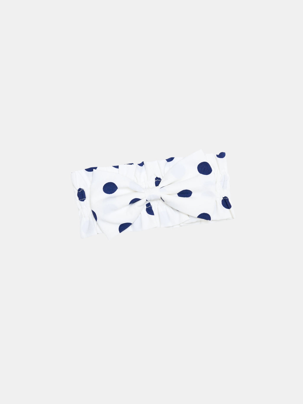 Oasis Polka Dot Bow Neckpiece in White with navy dots, soft gathers, and a decorative bow.