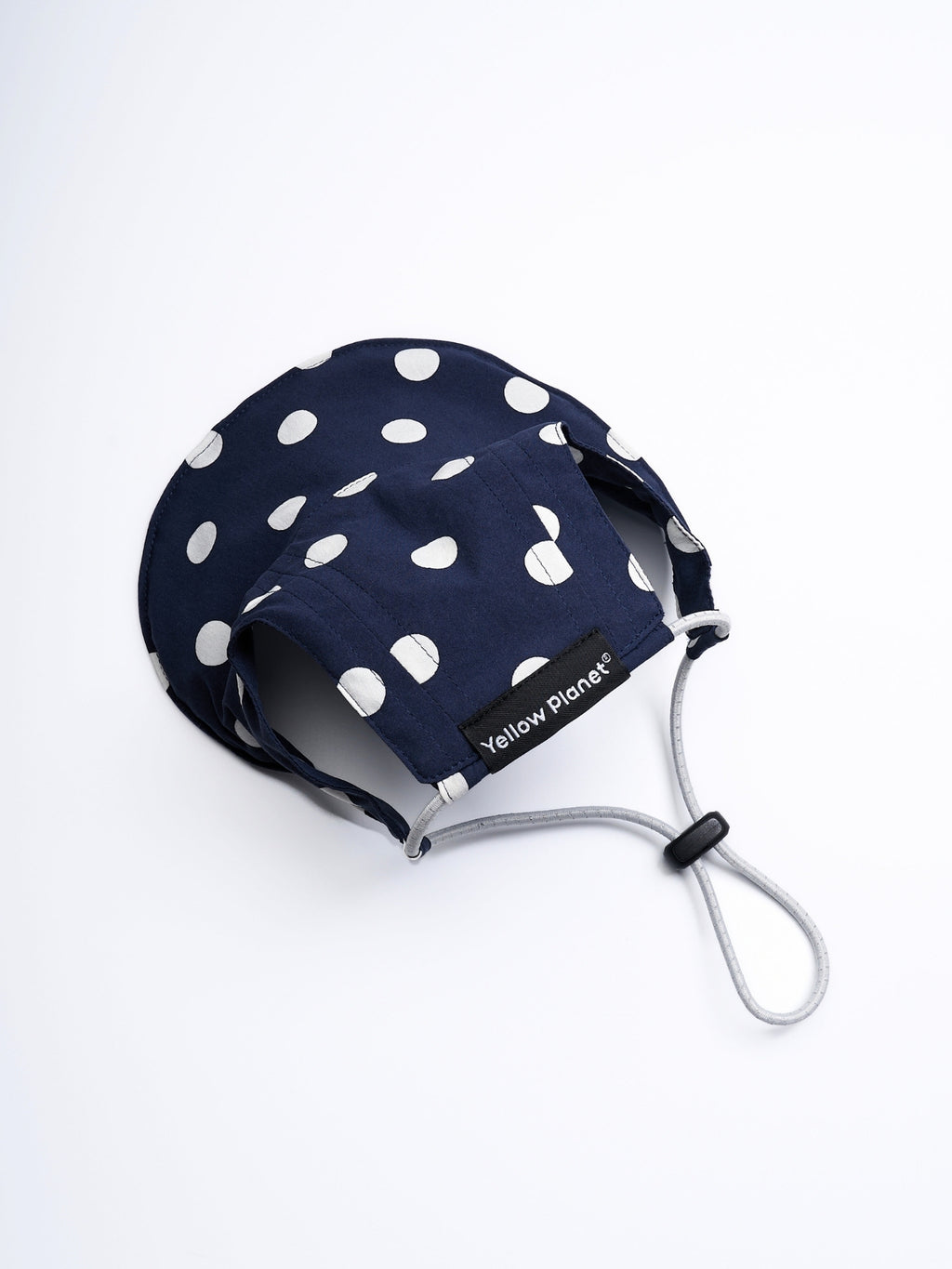 Rear view of the Oasis Polka Dot UV Pet Cap in Navy with ear openings, reflective elastic cord, and adjustable YKK cord stopper.