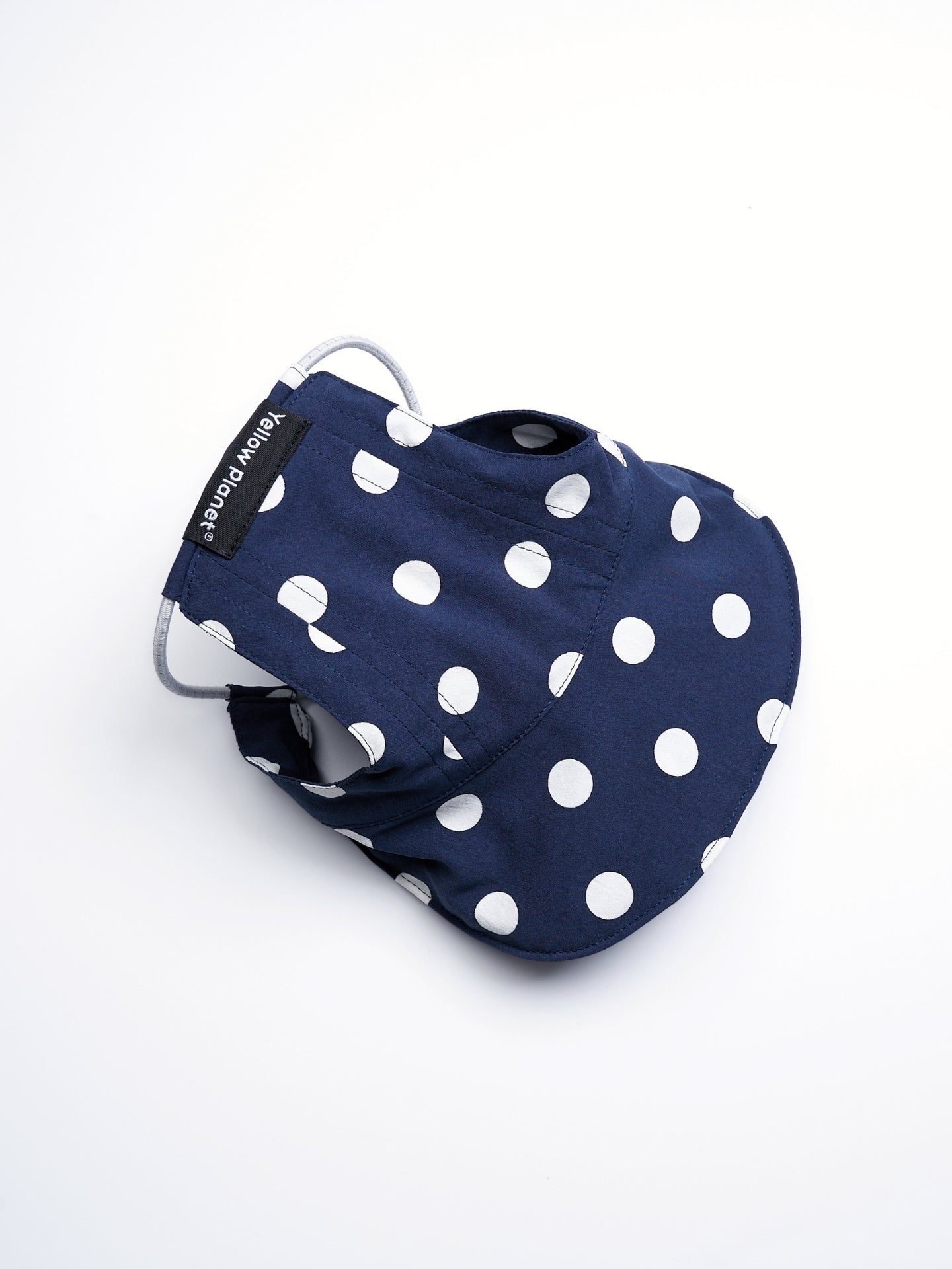 Top view of the Oasis Series Polka Dot UV Pet Cap in Navy, showing its lightweight structure and wide sun-protective brim.