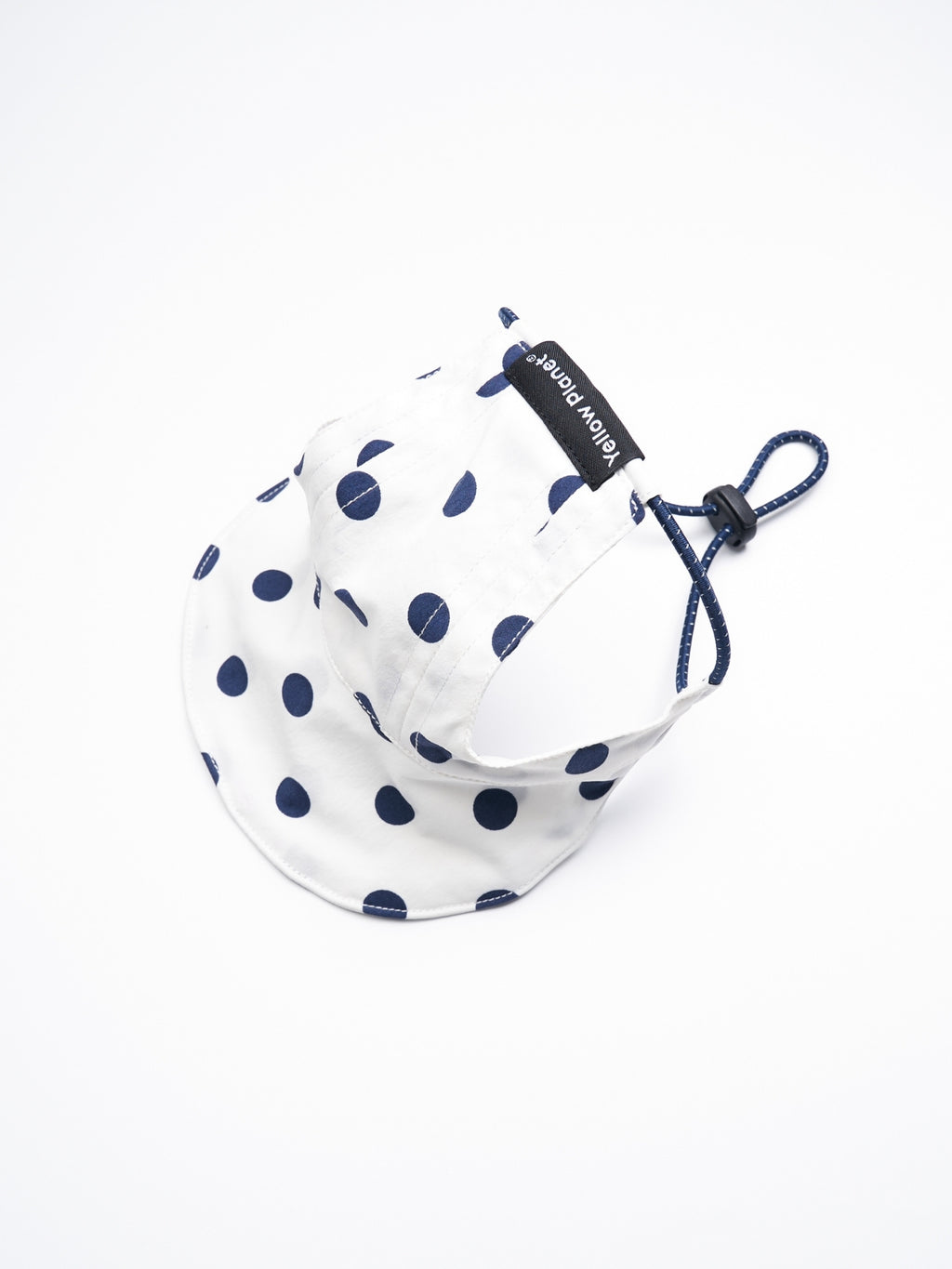 Rear view of the Oasis Polka Dot UV Pet Cap in White with ear openings, reflective elastic cord, and adjustable YKK cord stopper.