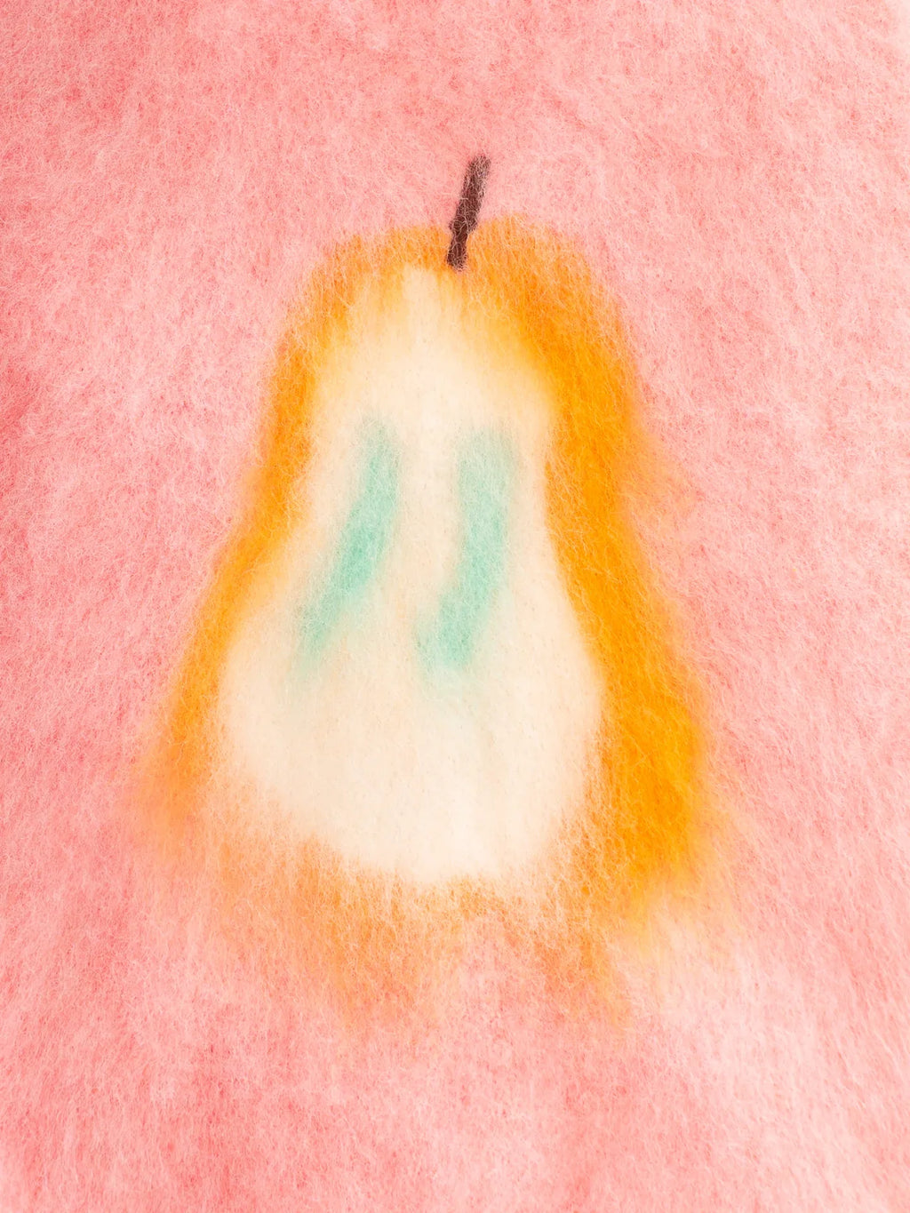 Close-up view of the Pink Pear brushed knit vest, highlighting the artistic pear graphic and fuzzy knit texture.