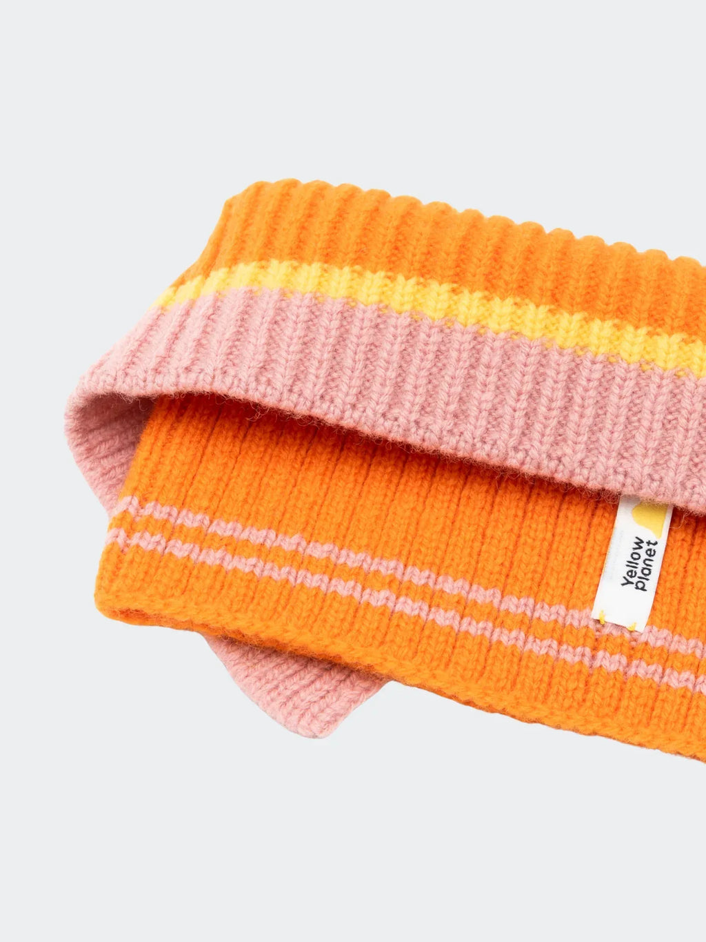 Close-up of the Vibrant Orange ribbed knit texture, highlighting the elasticated Merino wool and contrasting stripes.