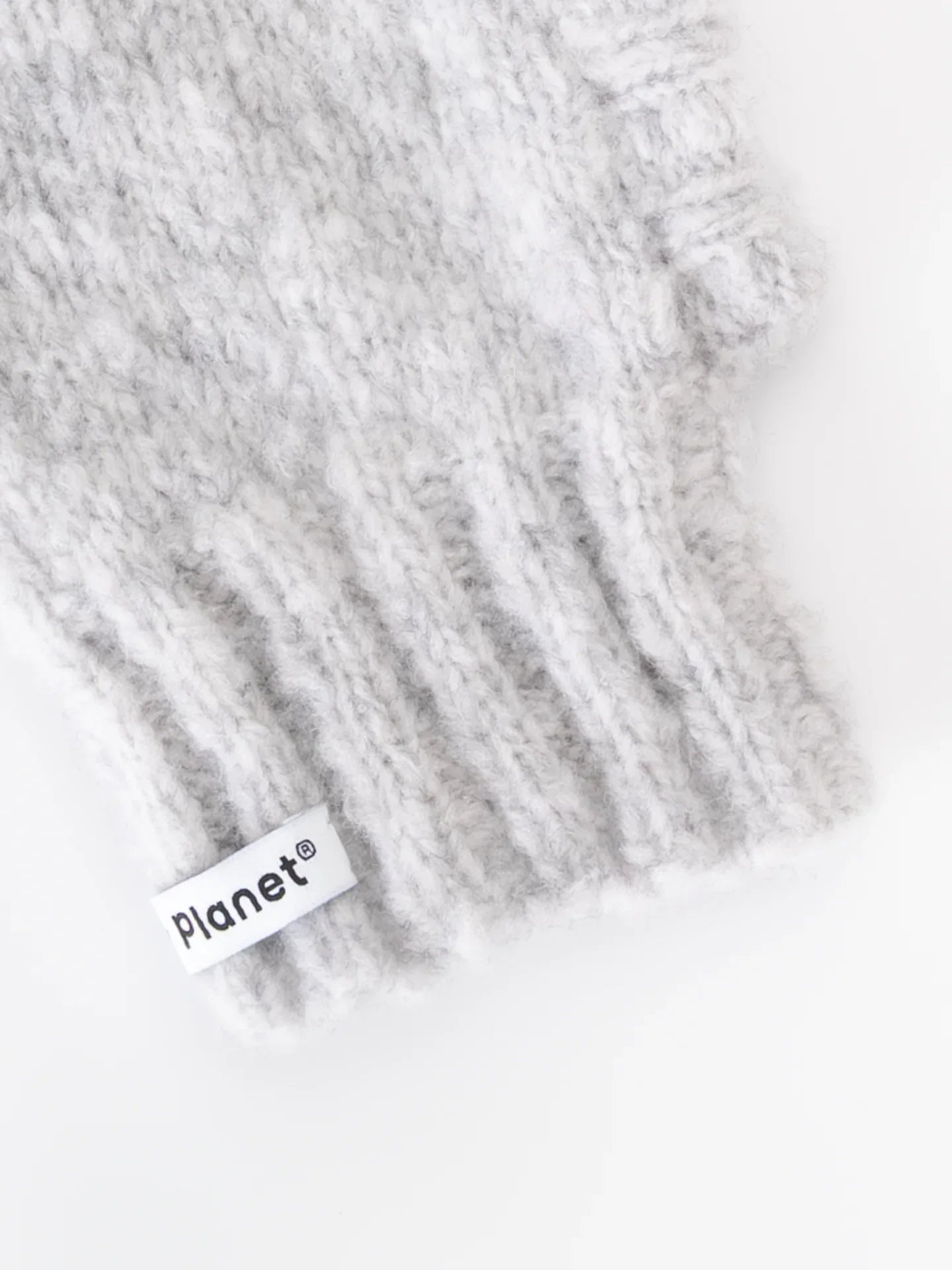 Close-up of the thick ribbed neck and "Yellow Planet" woven brand label on the smoke gray wool beanie.