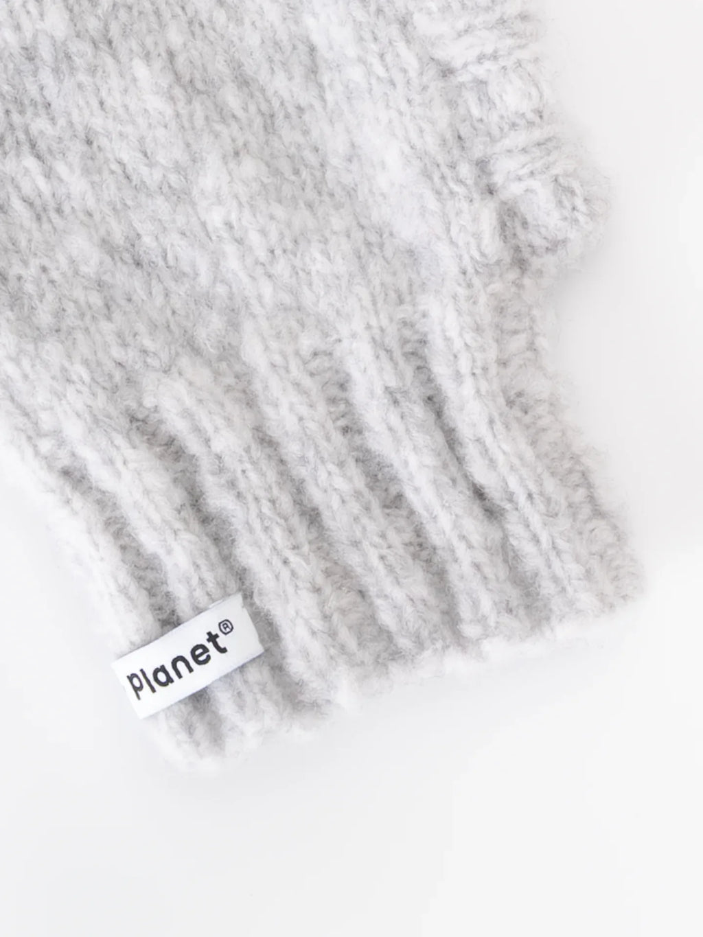 Detailed view of the comfortable ribbed neck and "Yellow Planet" woven brand label on the smoke gray wool pet snood.