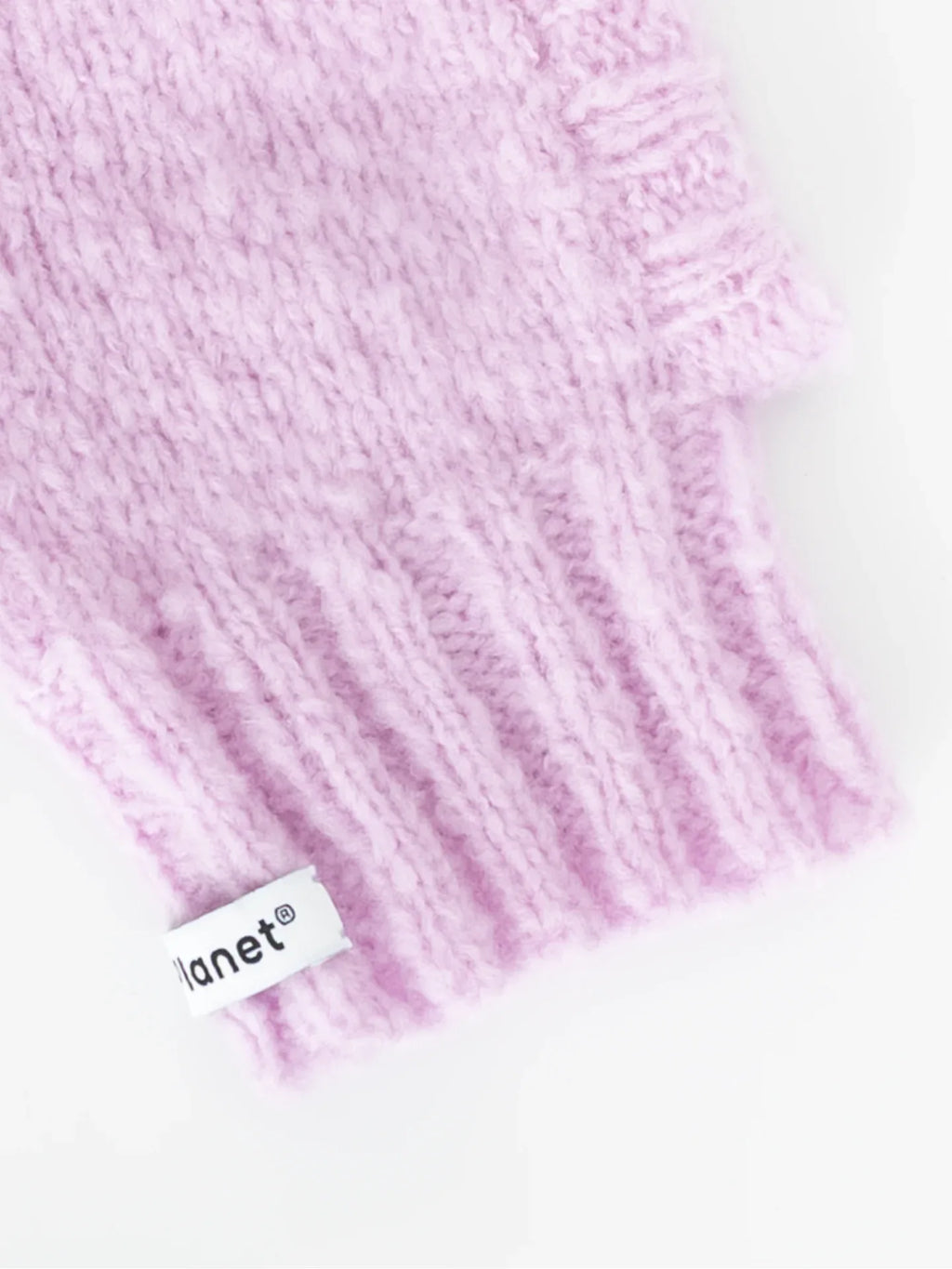 Detailed view of the flexible lavender ribbed neck and "Planet" brand woven label on the fuzzy wool pet snood.