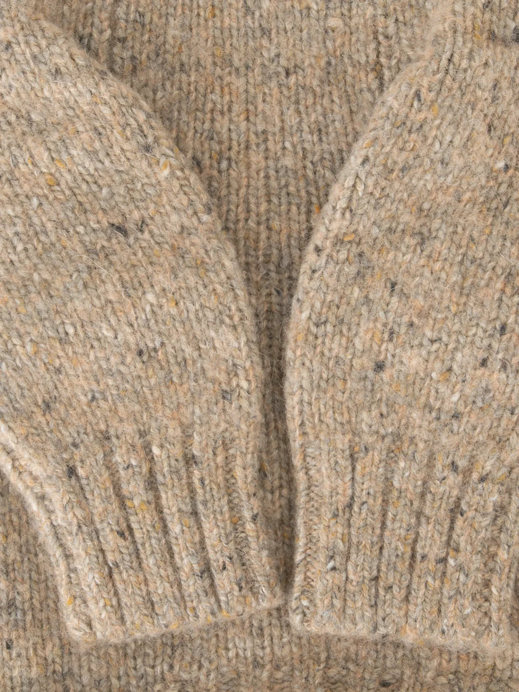 Close-up shot of the elasticated ribbed sleeve cuffs on the Walnut Tweed dog sweater.