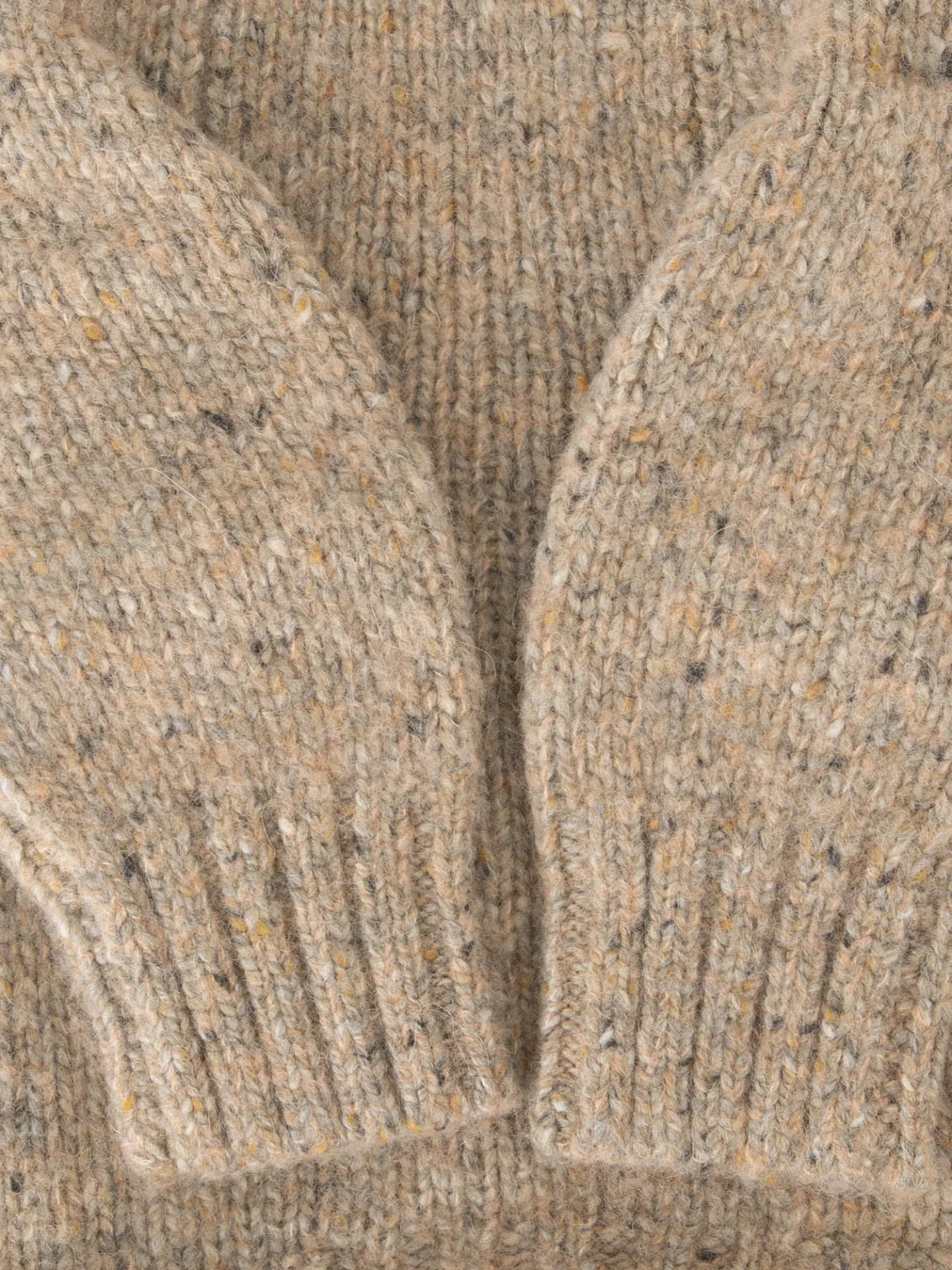 Close-up shot of the elasticated ribbed sleeve cuffs on the Walnut Tweed dog sweater.