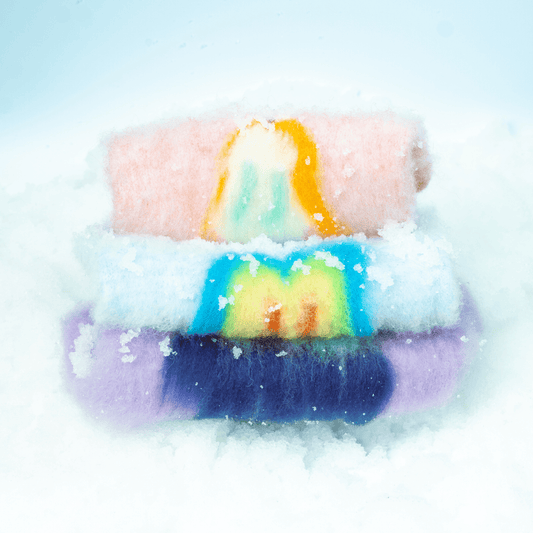 Yellow Market Series pet products stacked outdoors in snow, showcasing winter-ready pet apparel.
